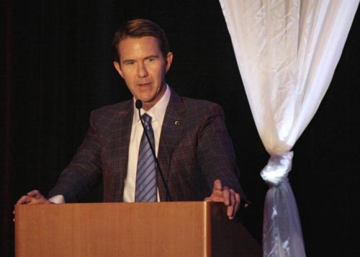 Dan Nilsen speaking at a podium
